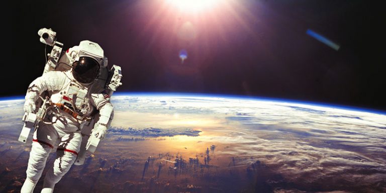 An astronaut in space, with Earth in the background