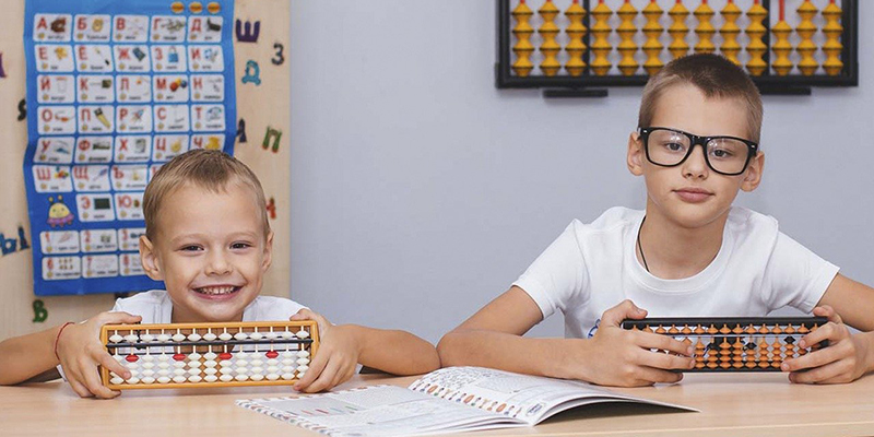 Siblings in school studying STEAM