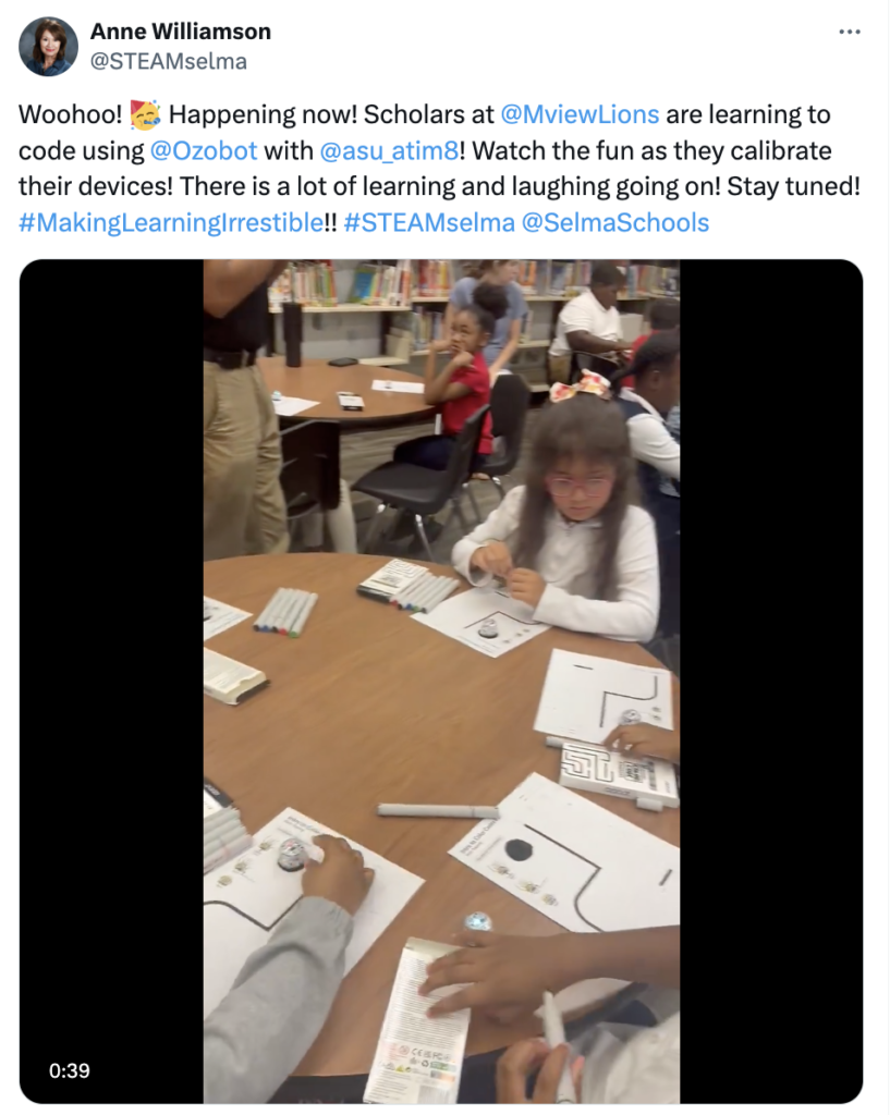 A photo showing students learning how to code with Ozobot programmable robots